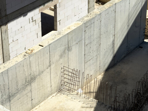 concrete construction site with reinforcement bars and shadows
