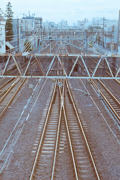 Railway tracks stretching through urban infrastructure