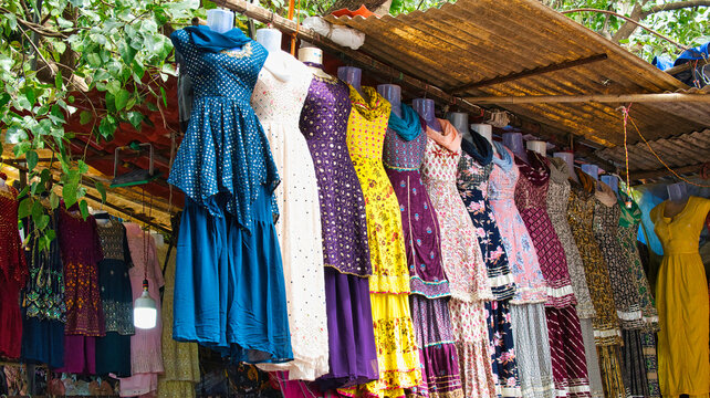 Colourful traditional dresses hanging in Mumbai market stall