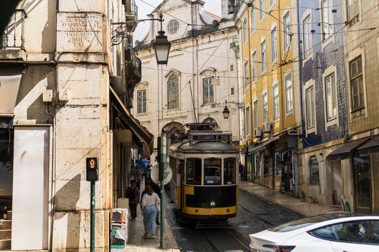 Famous Lisbon's 28 tram route on a narrow street in Lisbon