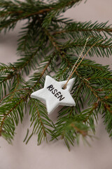 Christmas star with word RISEN Do it yourself air dry clay crafts for Christmas tree decoration holiday. Decoration gift idea Handmade children craft. Step by step instruction of painting, pressing
