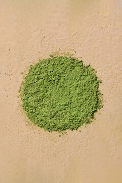 A striking image of green matcha powder forming a circle