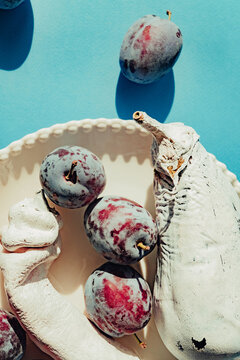 Art still life with eggplant, pepper and lums
