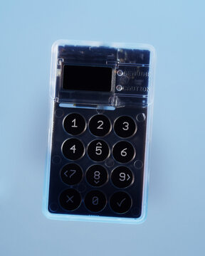 Bitcoin cold storage hardware wallet light blue background