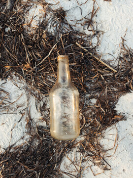 Glass bottle beach trash