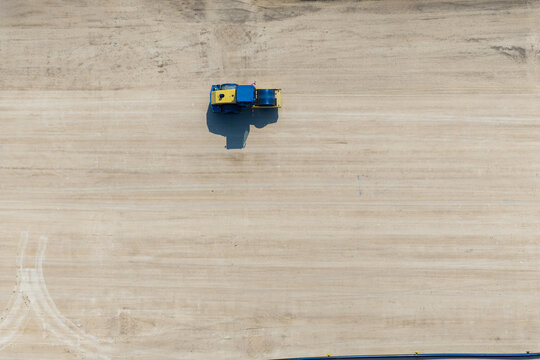 Aerial view of construction vehicle on sandy ground