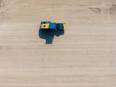 Aerial view of construction vehicle on sandy ground