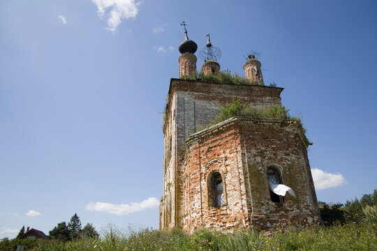 Historic abandoned church surrounded by wildflowers