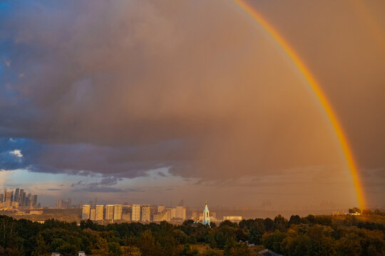 Rainbow arches over city skyline