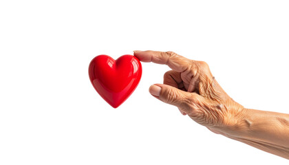 Obraz premium 高齢者の手が赤いハートにそっと触れる優しい瞬間