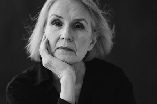 Portrait of a Mature Woman in Contemplative Pose With Soft Lighting