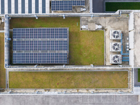 Aerial View of Sustainable Rooftop with Solar Panels and HVAC Sy