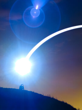 Silhouette under bright cosmic light