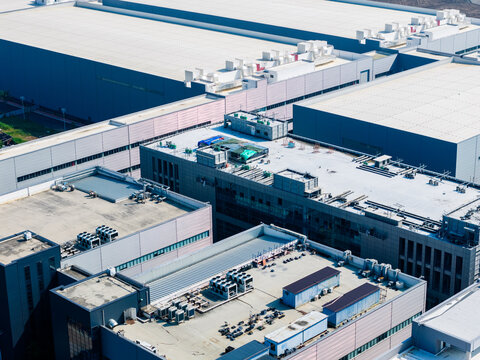 Industrial buildings with rooftop equipment and ventilation systems