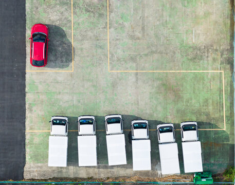 
Aerial View Parking Lot White Cars Red Vehicle Spaces