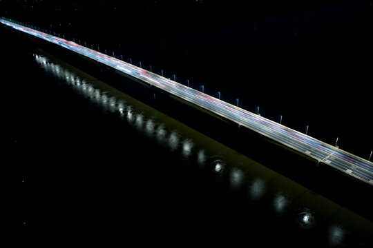 Aerial view of illuminated highway at night