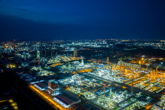 Aerial view of illuminated industrial complex at night