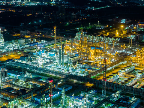 Aerial view of illuminated industrial complex at night