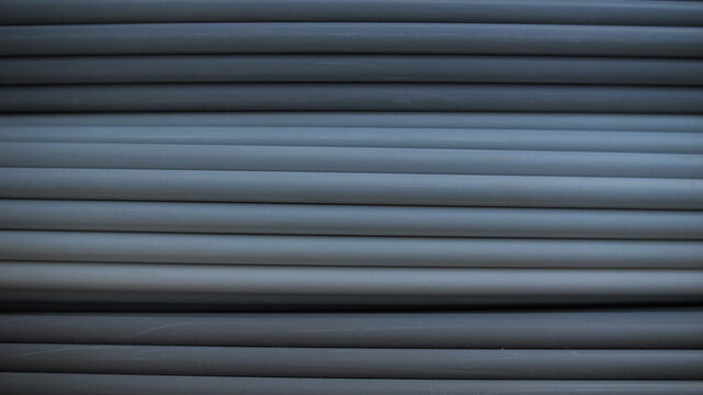 Stacked Plastic Pipes Close-Up