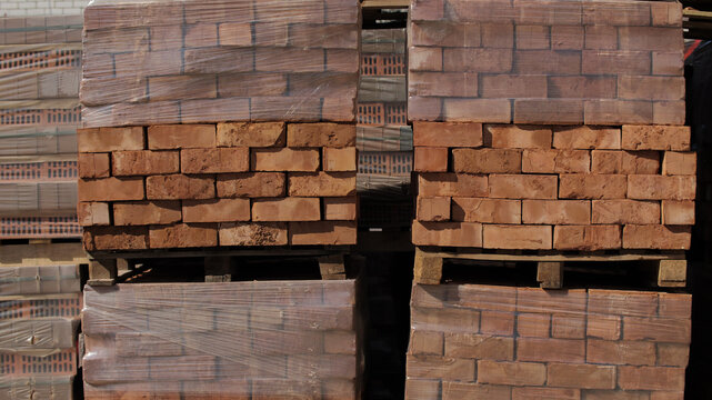 Pallets of Wrapped Red Bricks