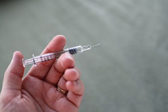 Hand Holding Needle