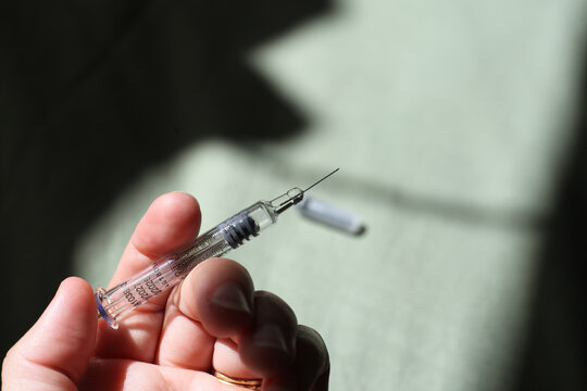 Hand Holding Needle