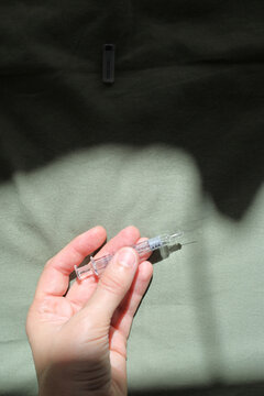 Hand Holding Needle