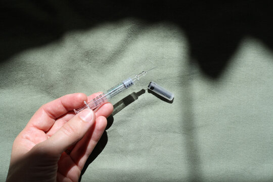 Hand Holding Needle