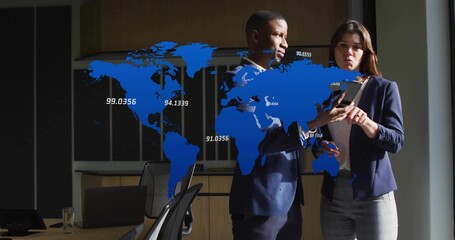 Analyzing professionals in business attire reviewing tablet data in office, with floating world map