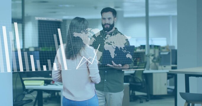 Discussing coworkers examining holographic world map and data chart display in open plan office