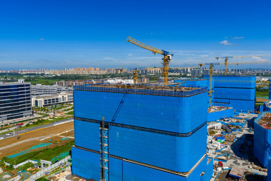 Aerial view of construction site with concrete formwork and cranes
