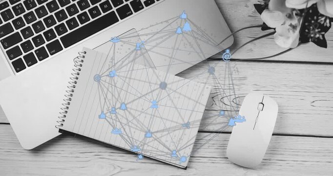 Starting desk view capturing network growing with icons and links over notebook, laptop and mouse