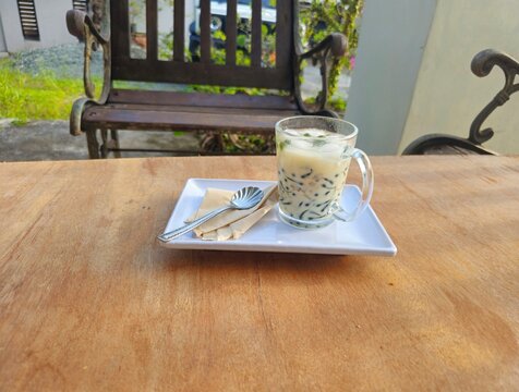 cup of coffeeCendol is an iced sweet dessert contains pandan flavored green rice flour jelly,coconut milk and pandan sugar,additional toppings are dinced jackfruit,red bean,durian.Javanese called Dawe