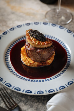 Filet mignon with foie gras, caviar, and red wine sauce