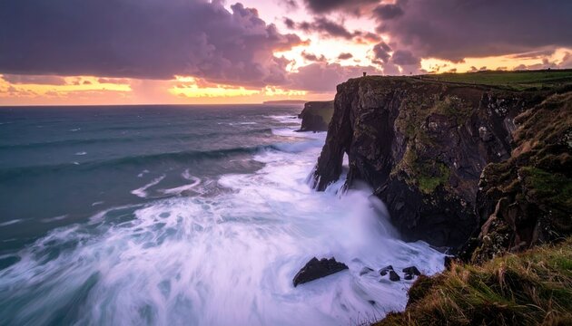Dramatic Coastal Cliffs with Crashing Waves Under a Colorful Sunset Sky Landscape Photography of Rugged Cliffs Coastline With Dramatic Weather and White Waves - Powered by Adobe