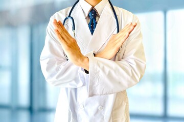 手でバツを作る男性医師 禁止のイメージ