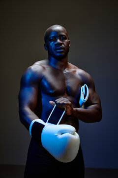 Boxer preparing for a match in dramatic lighting