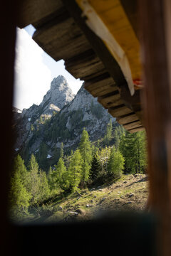 Mountain Peak Framed by Wooden Roof in the Austrian Alps