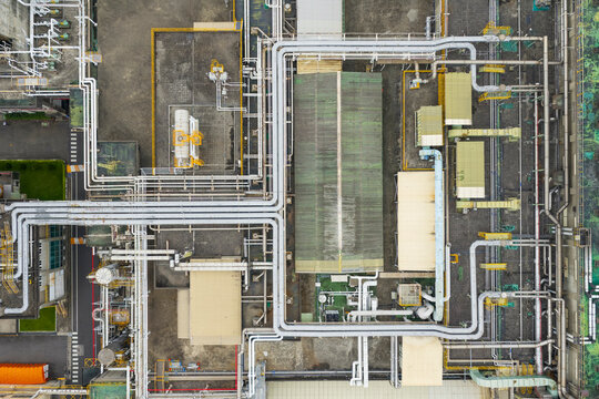 Aerial view of industrial facility with pipelines and buildings