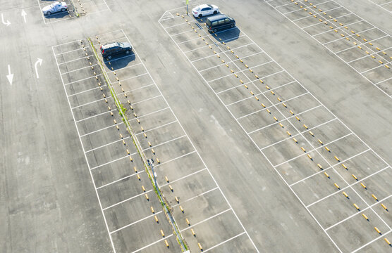 Aerial View of Large Parking Lot with Parked Cars