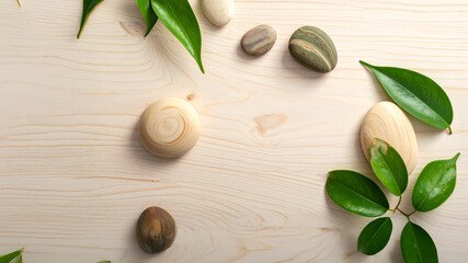 Tranquil Harmony: A Minimalist Zen Flat Lay of Smooth Wooden Stones and Lush Green Leaves on Light Natural Wood Texture