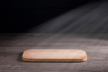 board Brown wooden floor in night atmosphere, dark background, light reflection on the floor, suitable for creating background images.