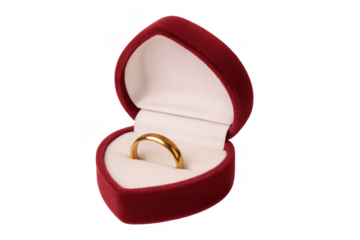 Gold wedding ring in heart shaped box isolating love