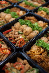 Indonesian catering meal boxes with traditional side dishes and vegetables