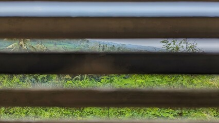 Close-up view reveals a stack of bamboo planks, showing texture and grain.