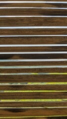 Close-up view reveals a stack of bamboo planks, showing texture and grain.