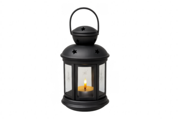 Black metal lantern with burning candle and star cutouts