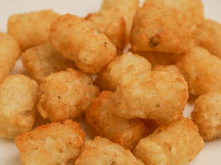 Potato nuggets on white background