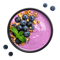 A vibrant overhead shot of a purple smoothie bowl, topped with berries, granola, and mint