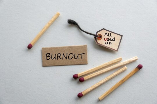 Burnout Concept with Matches and Tag Indicating Feeling of Being All Used Up in Modern Society